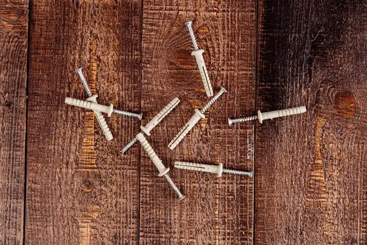 Close-up view of wood planks and screws, ideal for DIY or construction themes.